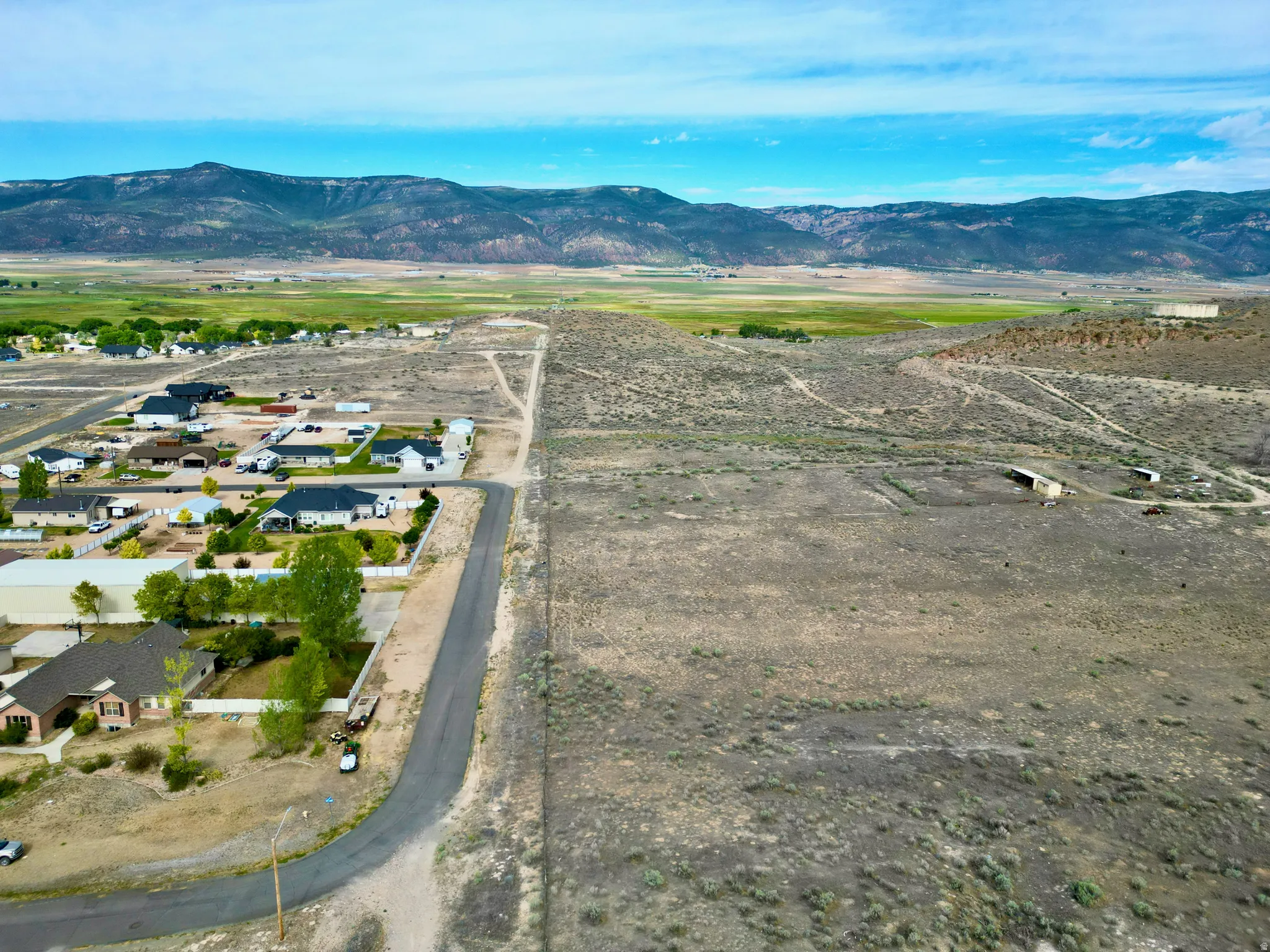 Expansive undeveloped land bordering an established residential area