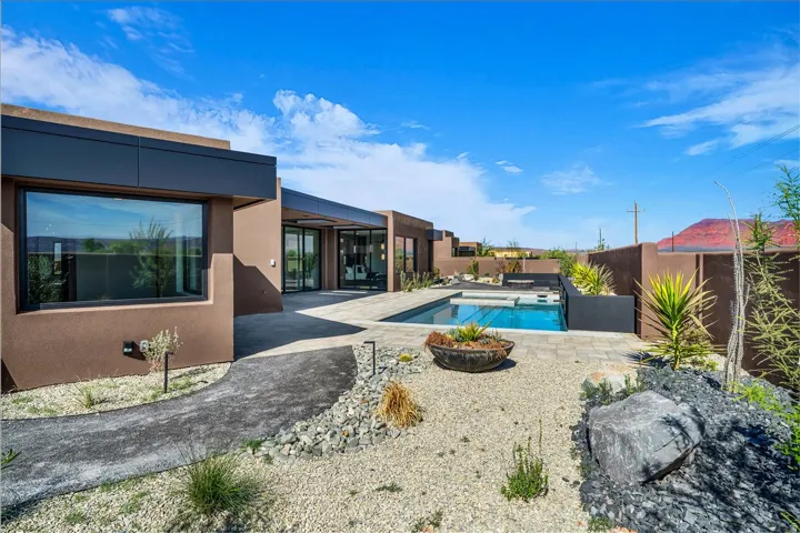 Modern exterior with a stucco finish and dark trim