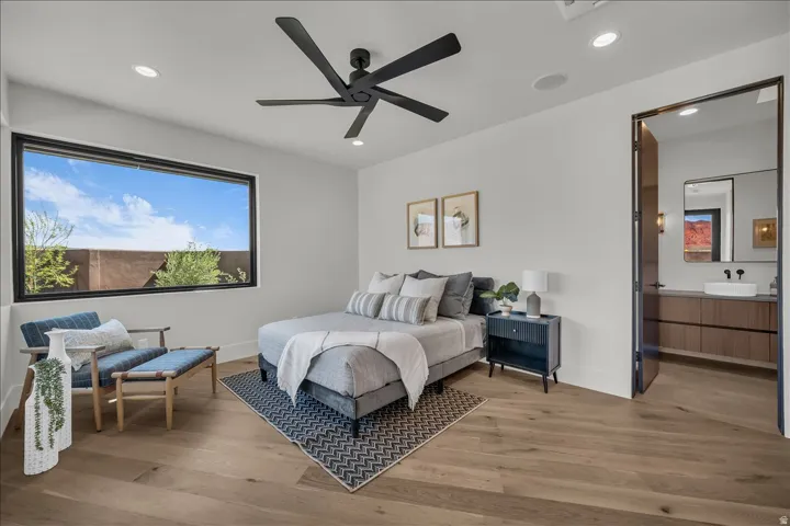 Wood-finish flooring, recessed lighting, and a modern ceiling fan