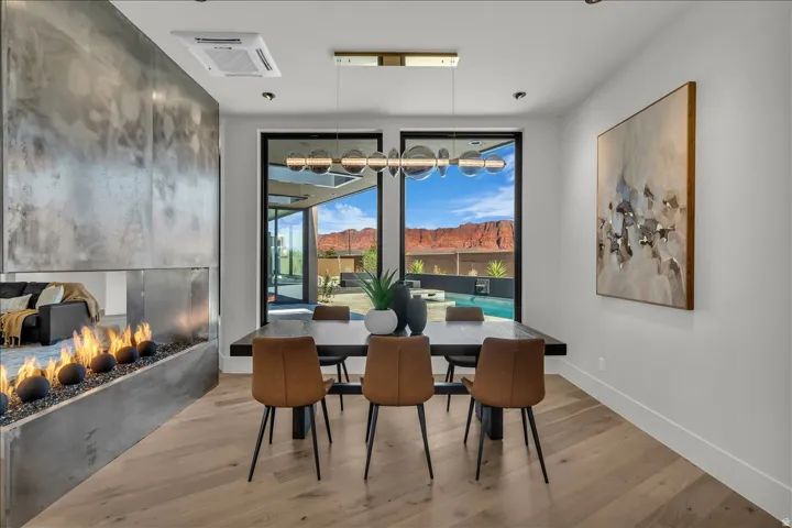 Contemporary linear fireplace with a textured metal surround
