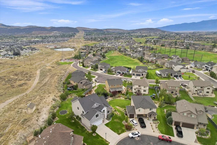 Residential community with varied architectural styles and surrounding natural landscapes