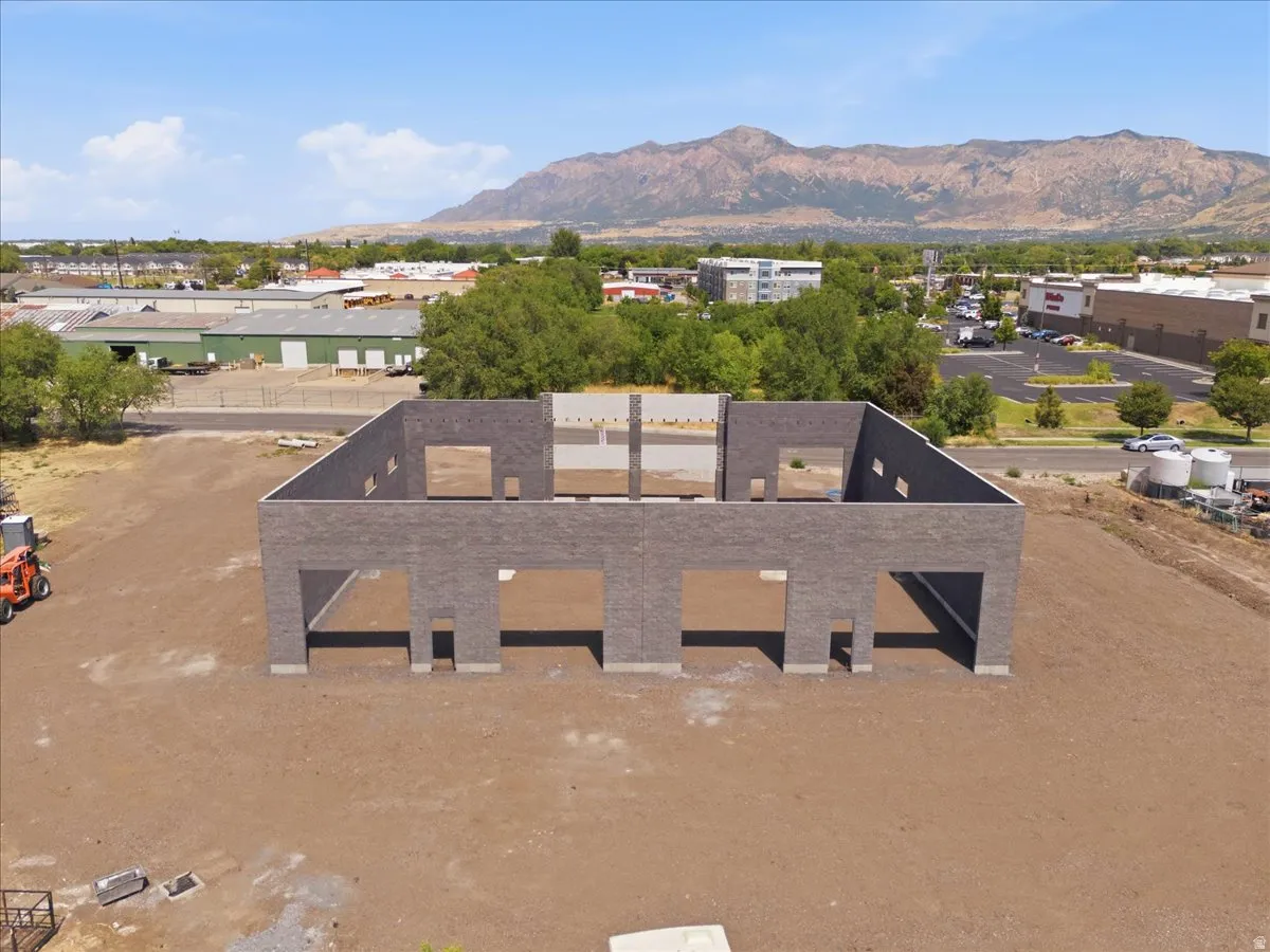 Masonry construction with multiple openings and a mountainous backdrop
