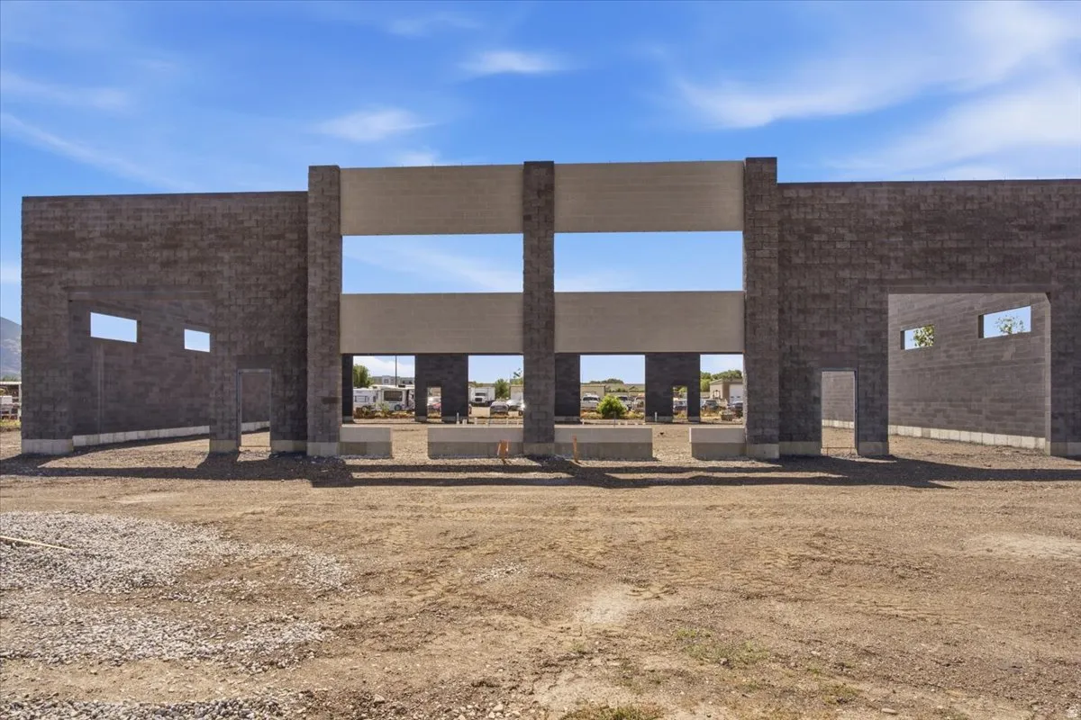 Concrete block construction featuring multiple openings and structural beams