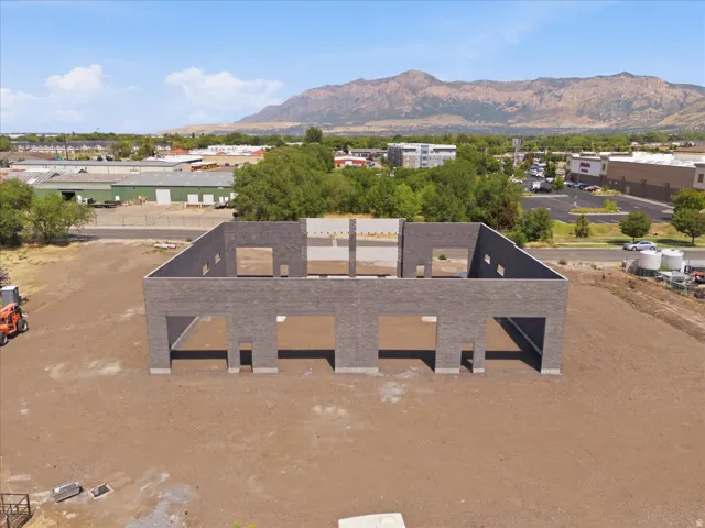 Masonry construction with multiple openings and a mountainous backdrop