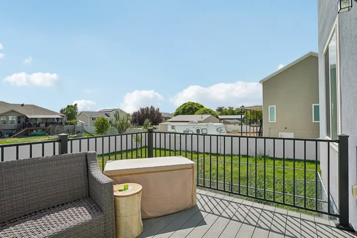 Upper-level deck with composite decking and black metal railings