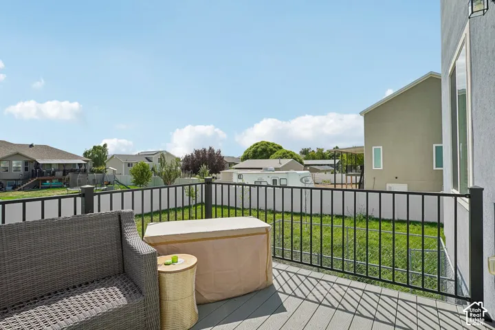 Upper-level deck with composite decking and black metal railings