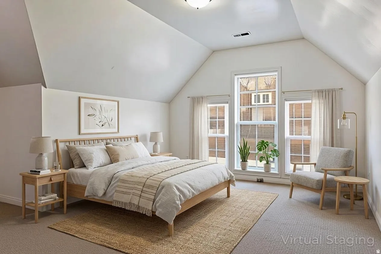 Vaulted ceiling, carpeted flooring, large window with transom, two side windows, and wall-mounted light fixture