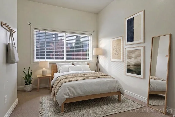 Vaulted ceiling, window with blinds, wood-finish flooring, recessed lighting, and light neutral wall tones
