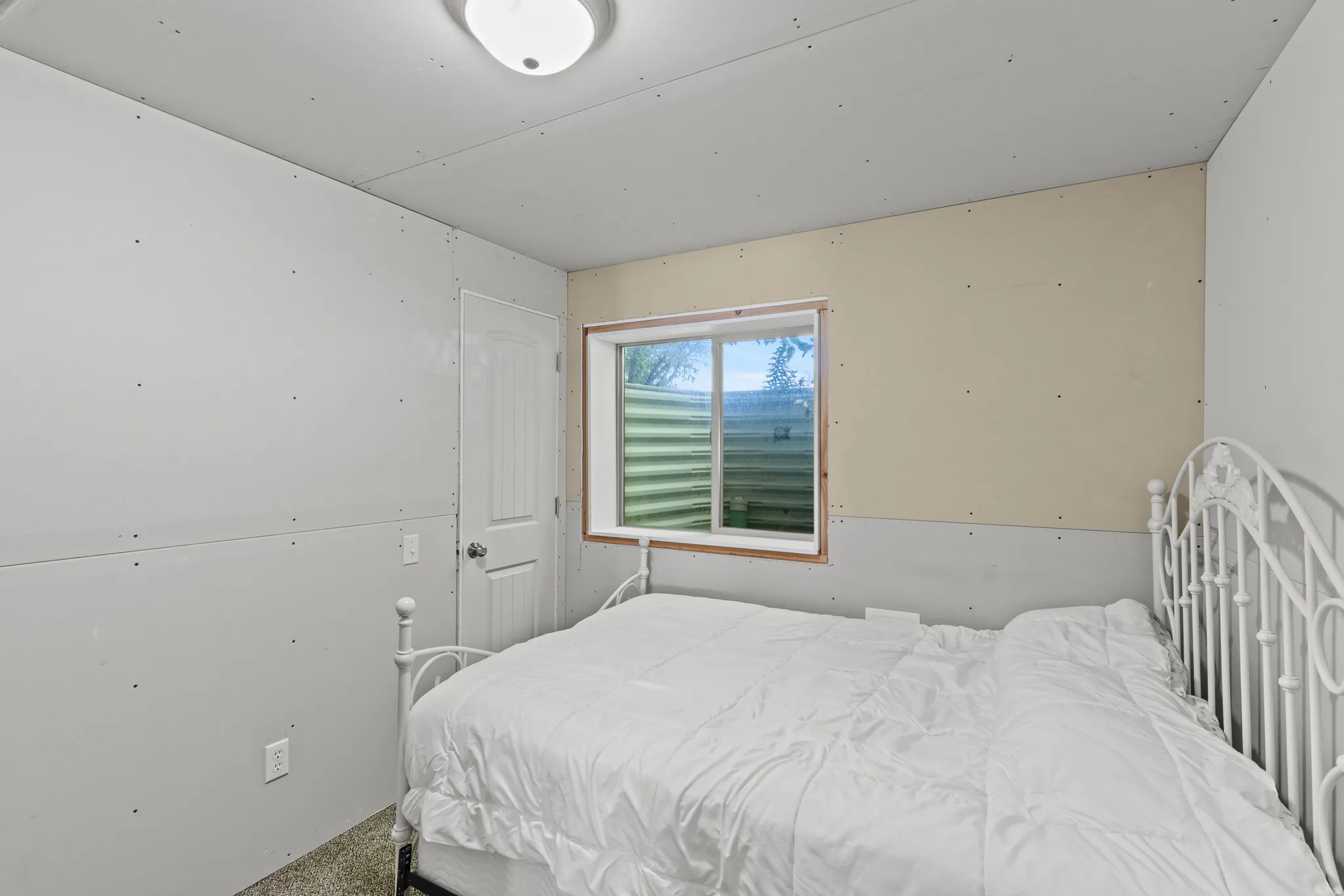 Unfinished Basement bedroom.