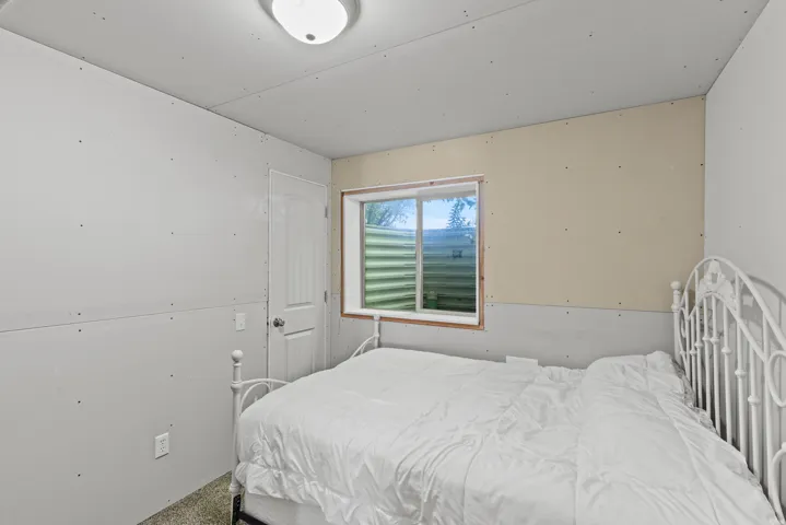 Unfinished Basement bedroom.