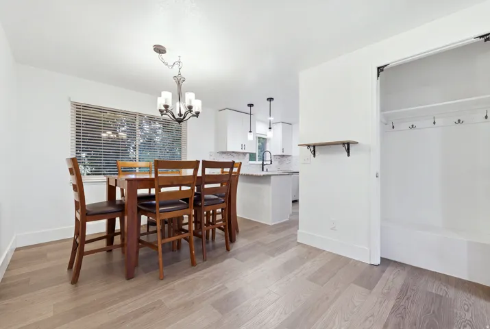 Wood-finish flooring throughout, with a built-in hall tree featuring coat hooks and shelving