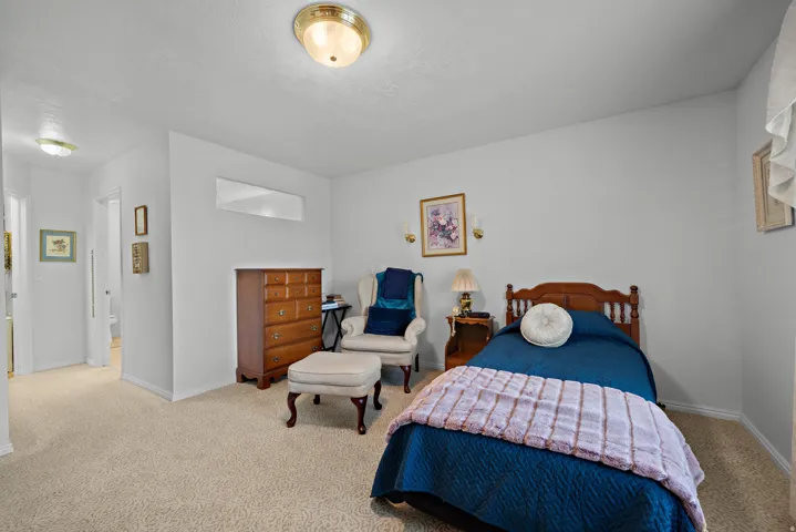Wall-to-wall carpeting throughout, with a built-in recessed wall niche