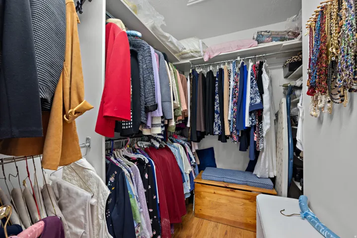 Built-in shelving and hanging rods provide extensive storage
