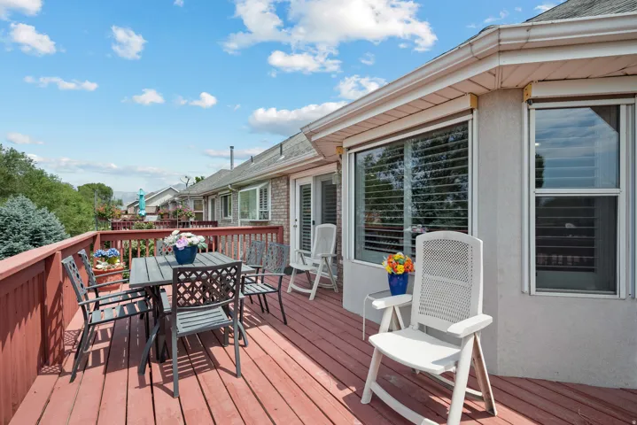 Expansive outdoor deck featuring wood flooring and railings