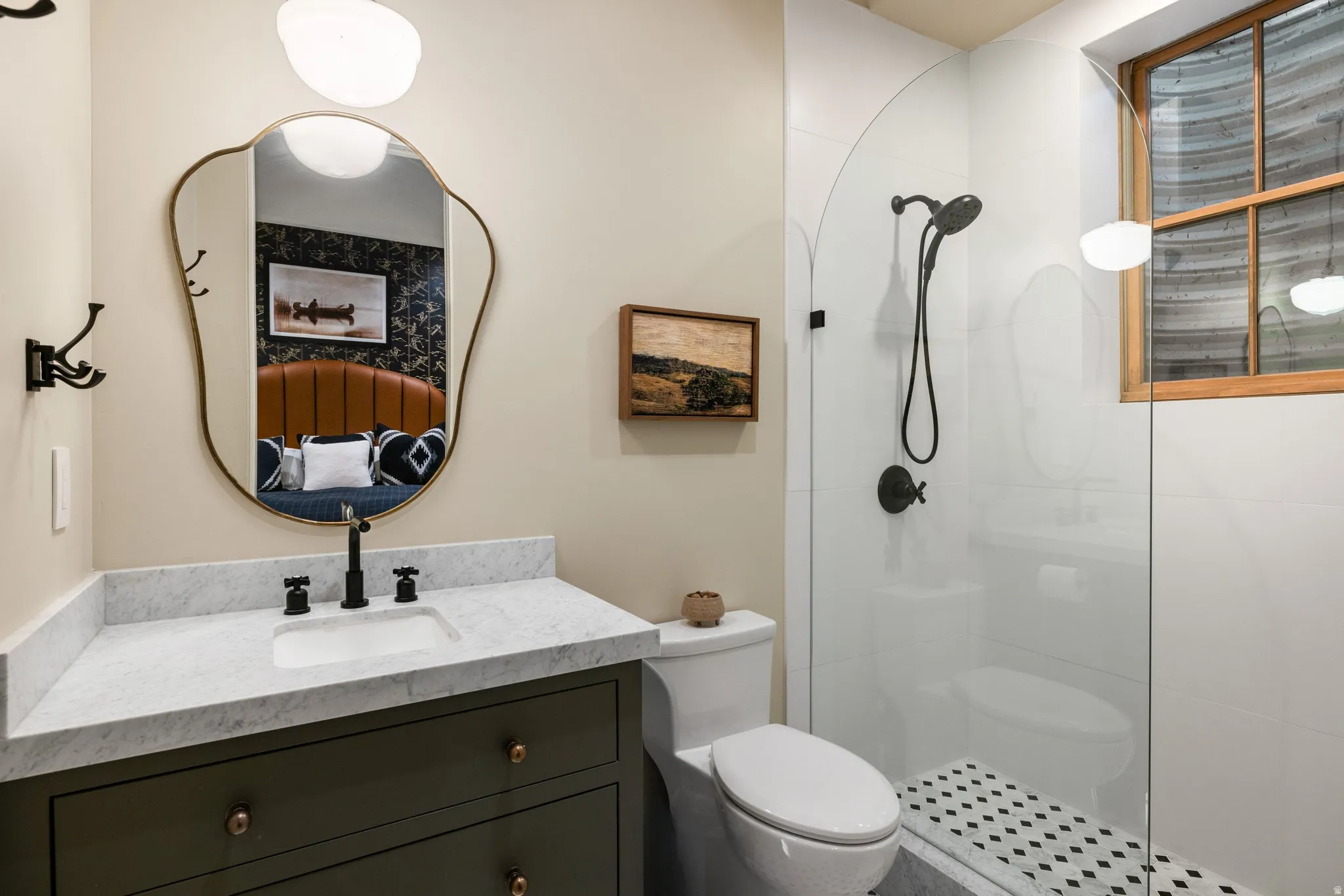 Vanity with white countertop, dark green cabinetry, and matte black fixtures