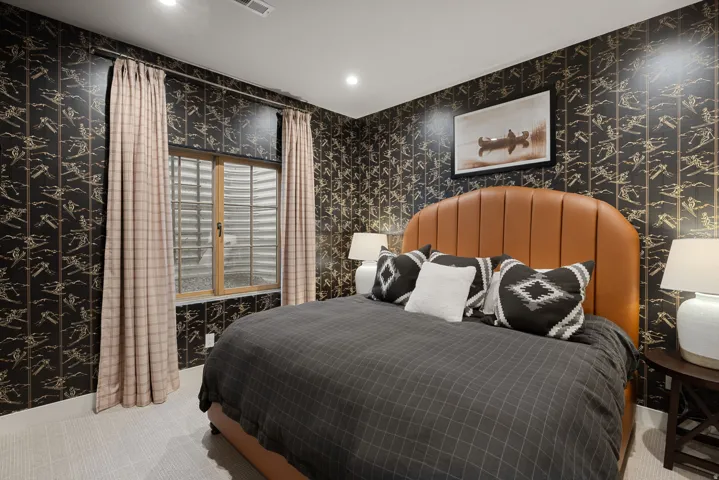 Recessed lighting, patterned wall covering, wood-framed window, and light-toned flooring