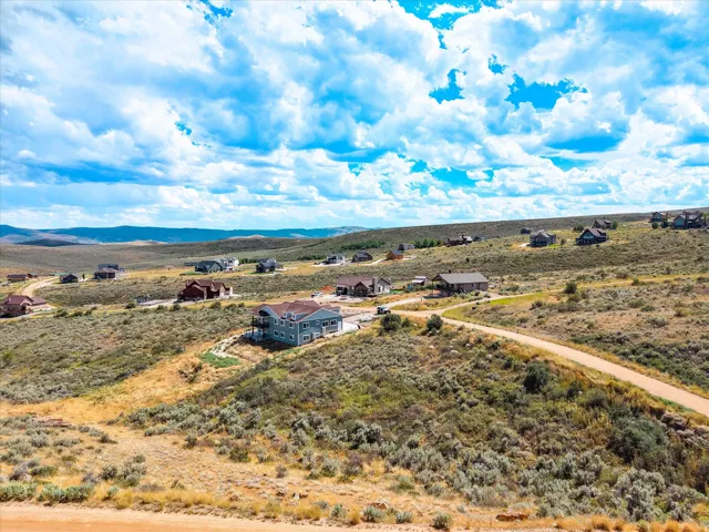 Sprawling rural property featuring multiple residences and outbuildings situated across expansive sagebrush terrain
