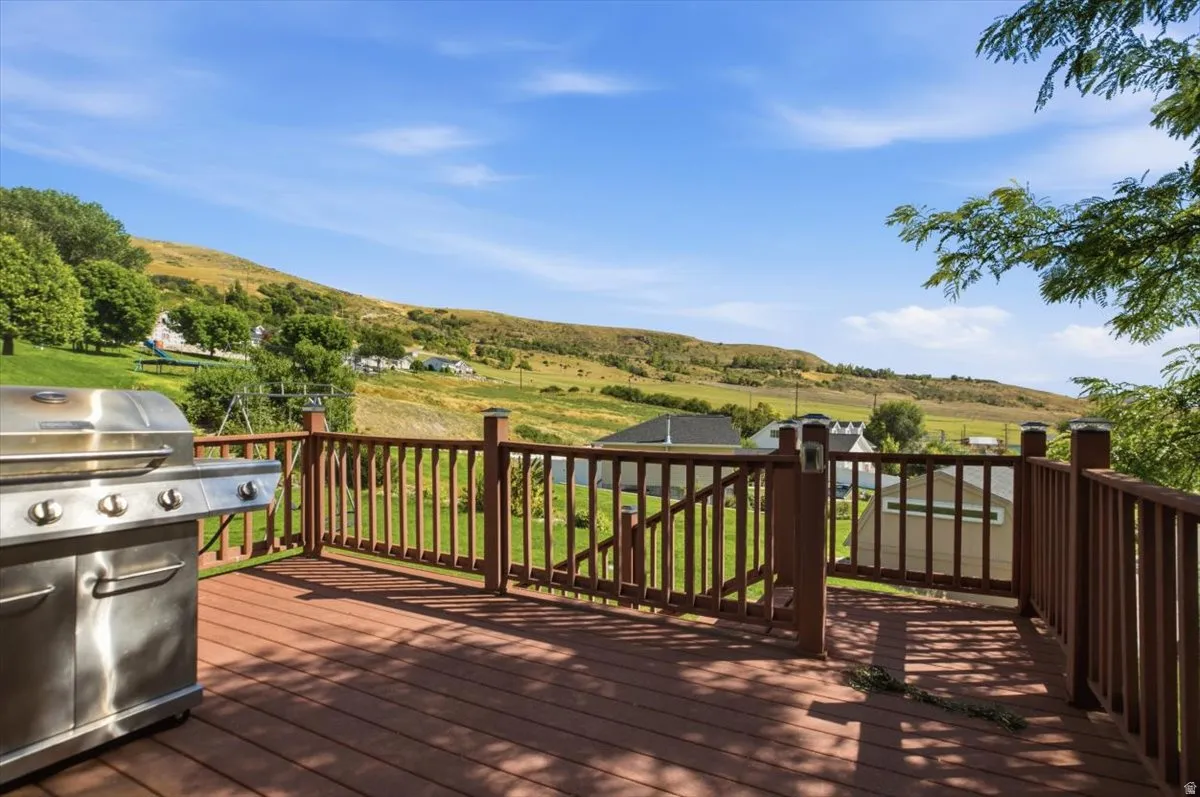 Expansive outdoor deck with wood-finish flooring and railing
