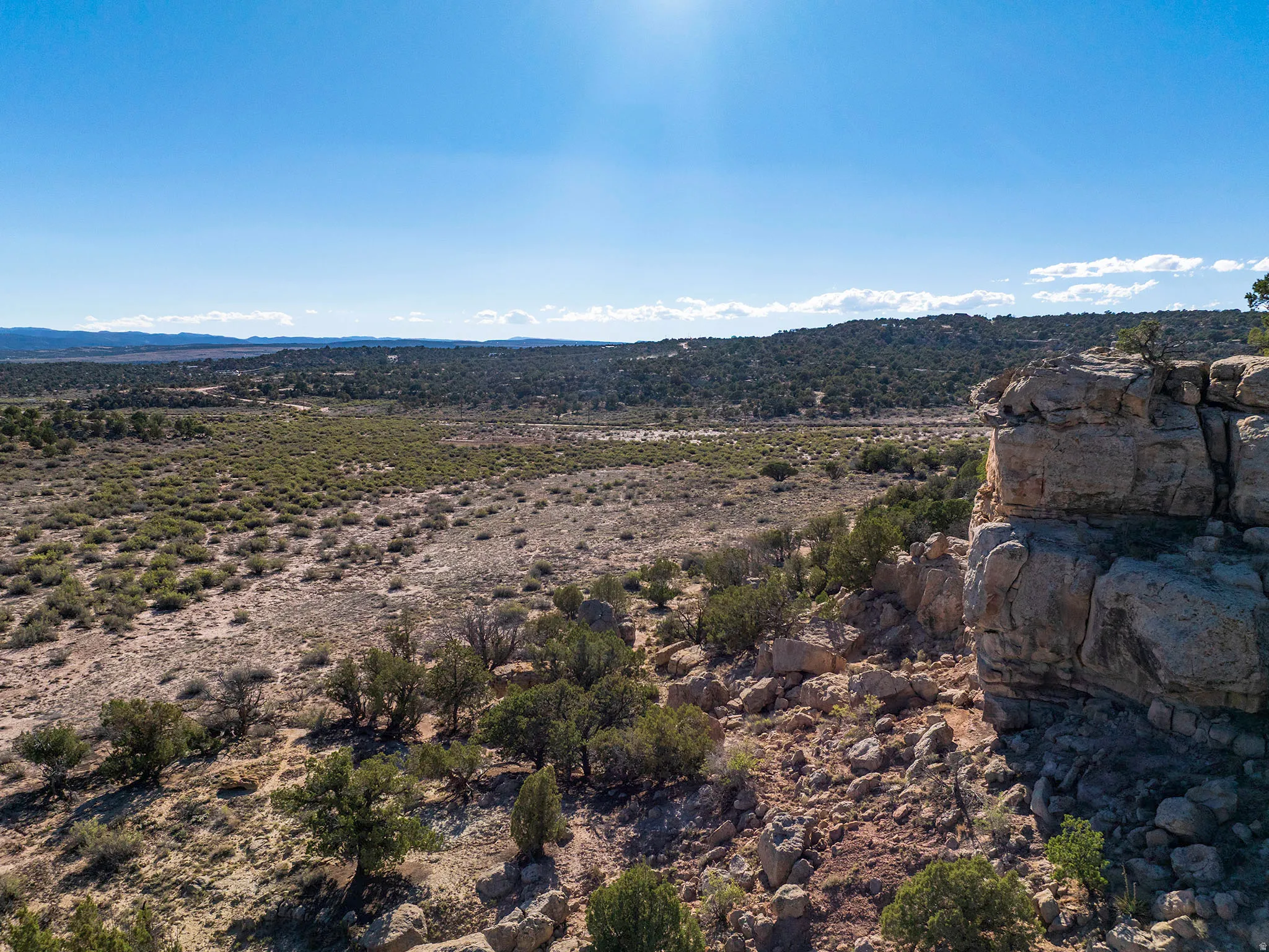 Elevated rock formations, diverse vegetation, and expansive natural landscape