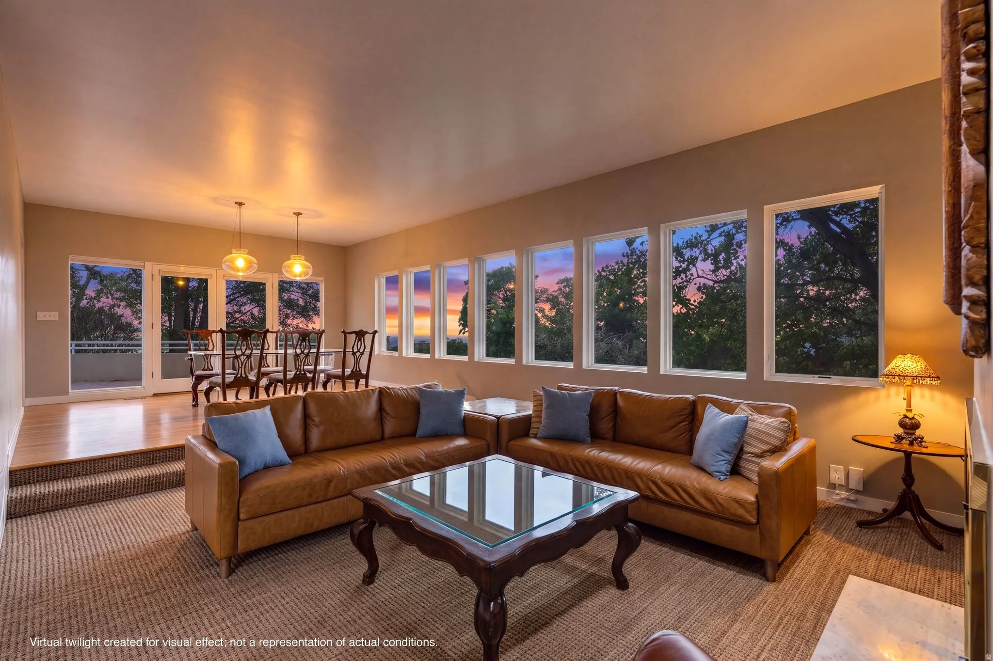 Recessed dining area with hardwood flooring and pendant lighting
