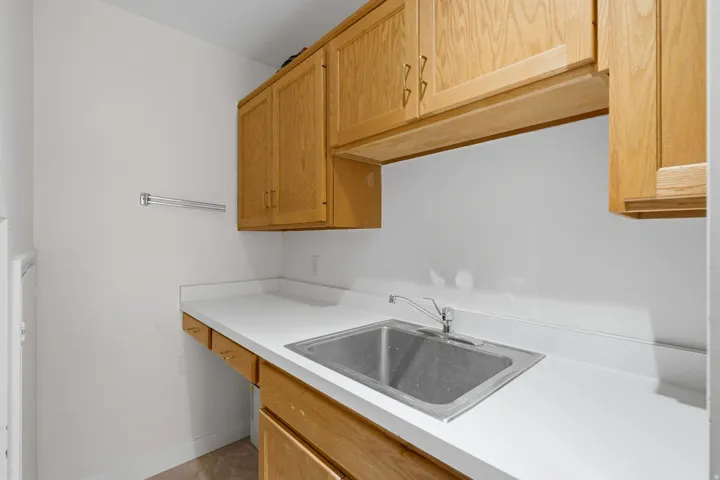Solid surface countertop with an integrated stainless steel sink