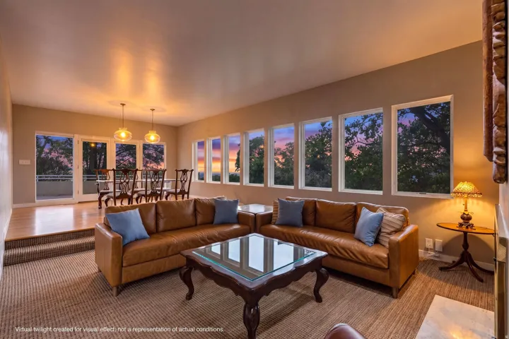 Recessed dining area with hardwood flooring and pendant lighting