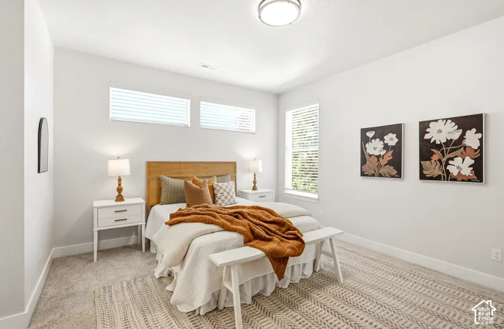 Recessed windows with blinds, light gray wall paint, and overhead flush-mount lighting