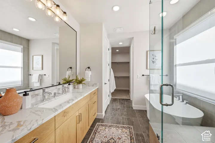 Double vanity with integrated sinks and wood-finish cabinetry