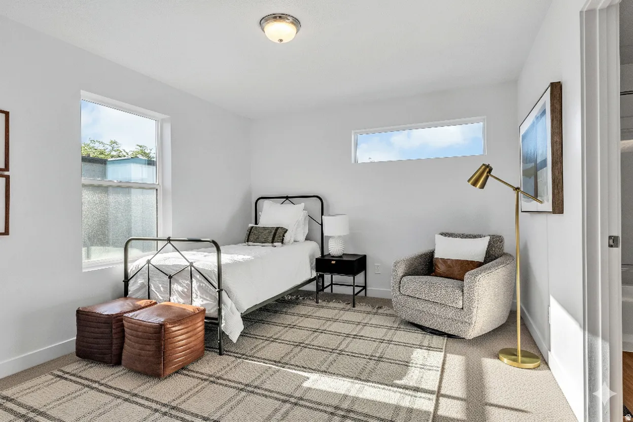 Recessed lighting, large window with ample natural light, additional transom window, light-colored carpeting, white walls