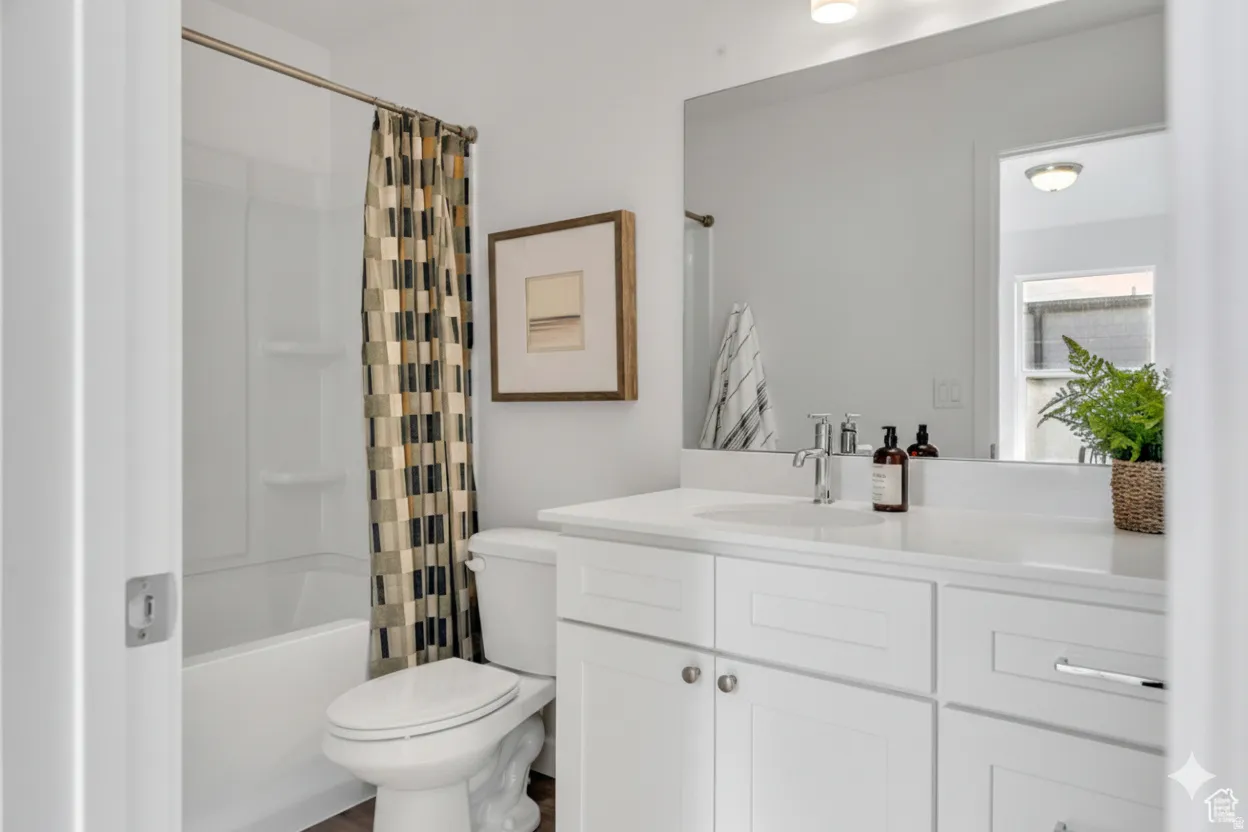Spa-inspired bathroom featuring a white vanity with dual sinks, quartz countertop, and chrome hardware