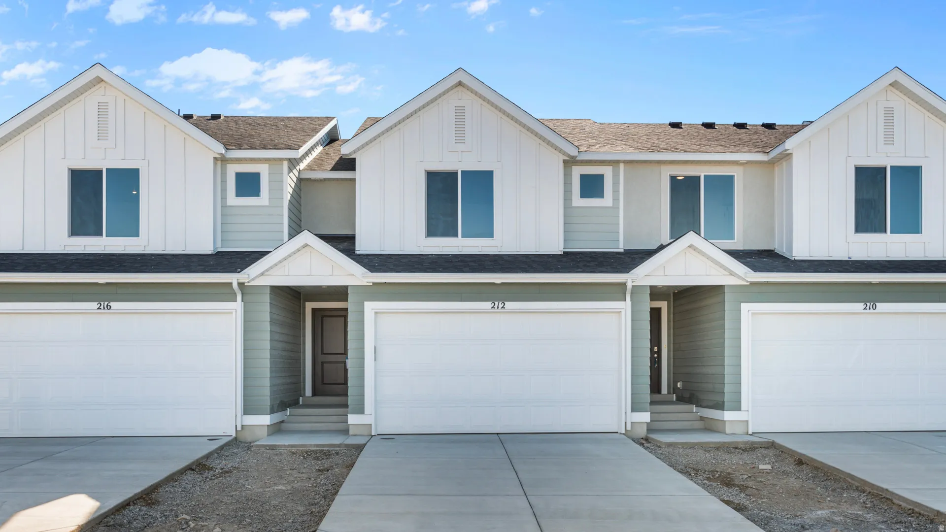 Contemporary townhome exterior with horizontal siding and vertical board and batten accents