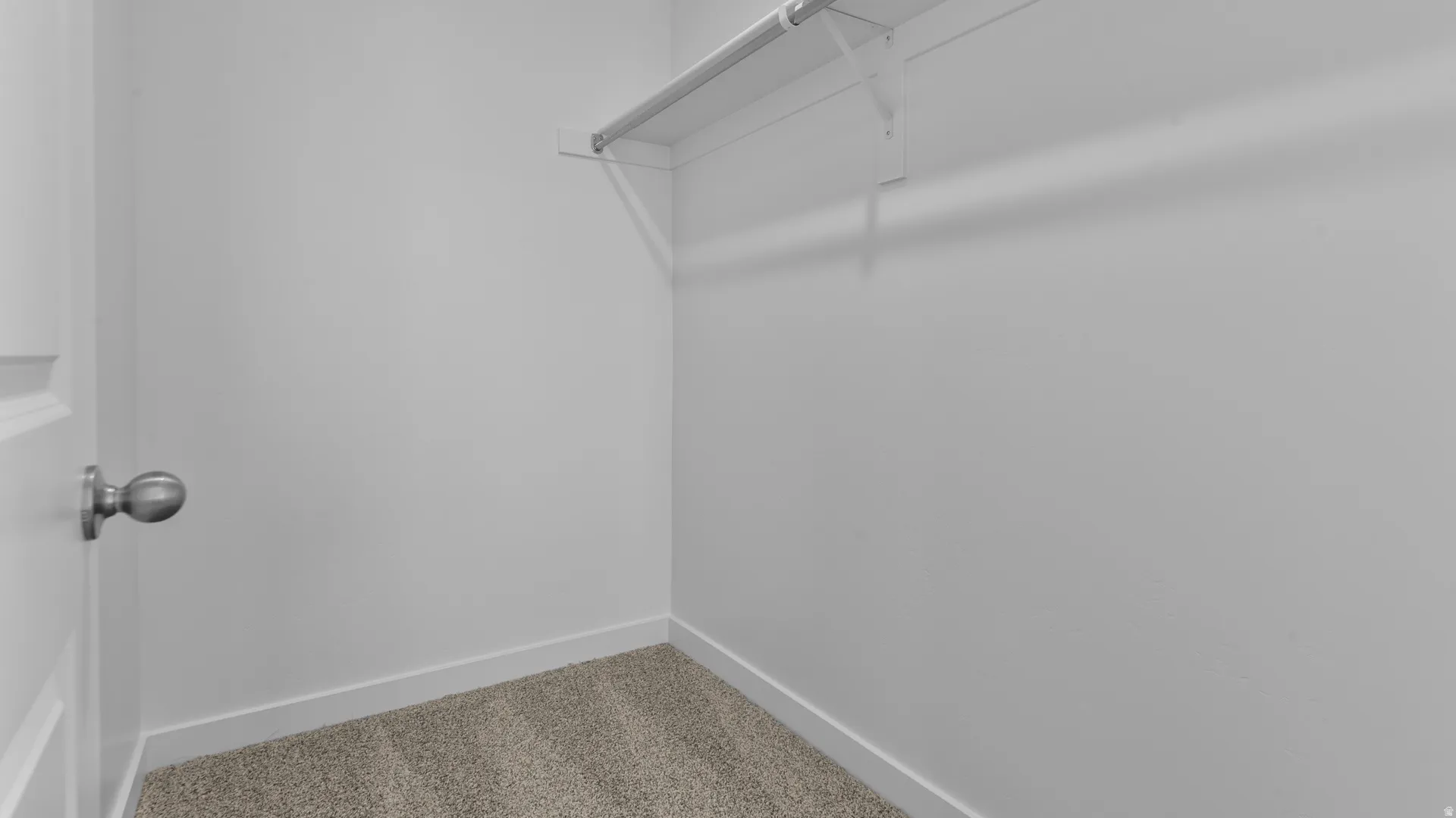 Wall-to-wall carpeting and neutral wall tones