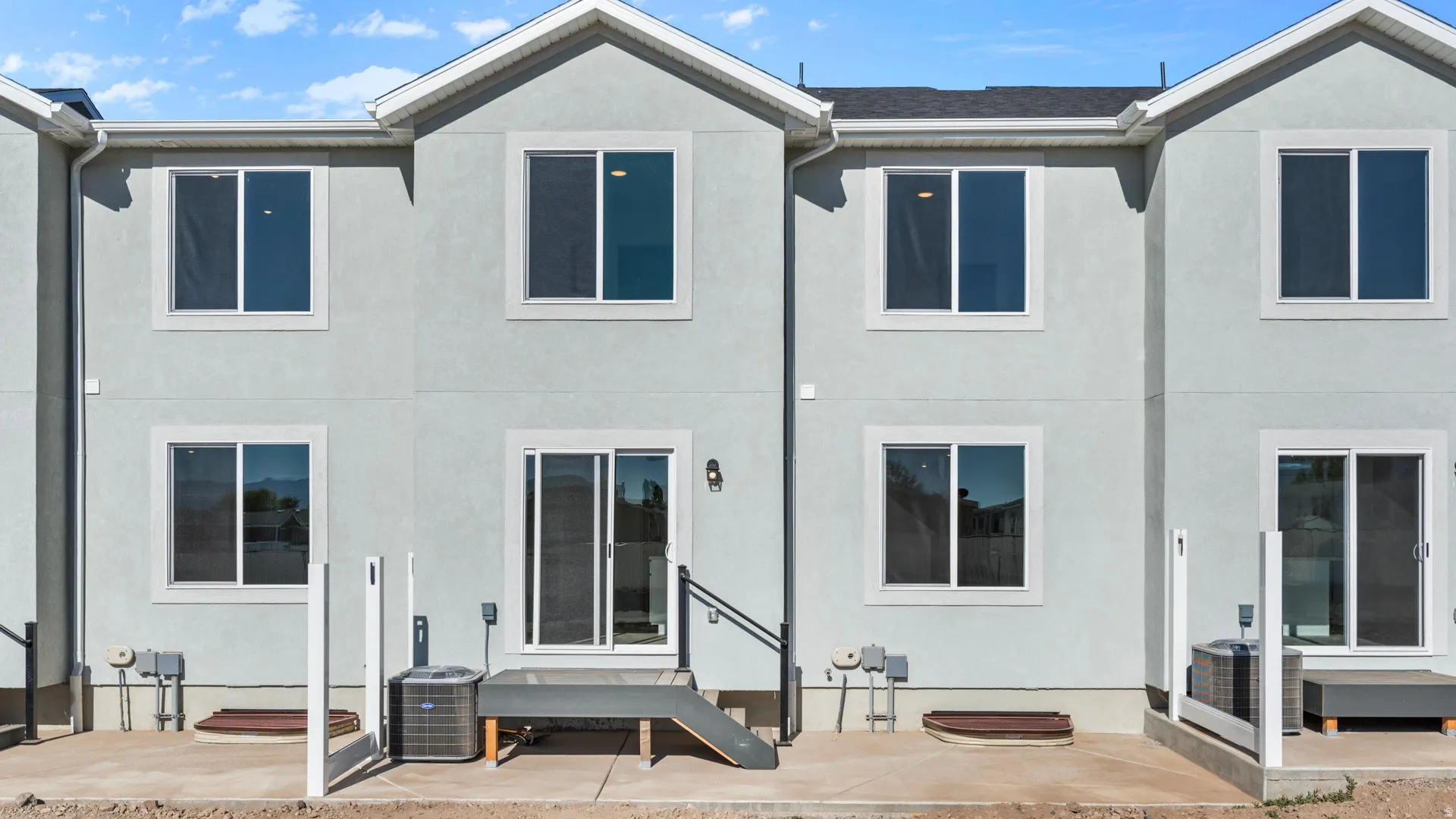 Exterior stucco finish with multiple windows