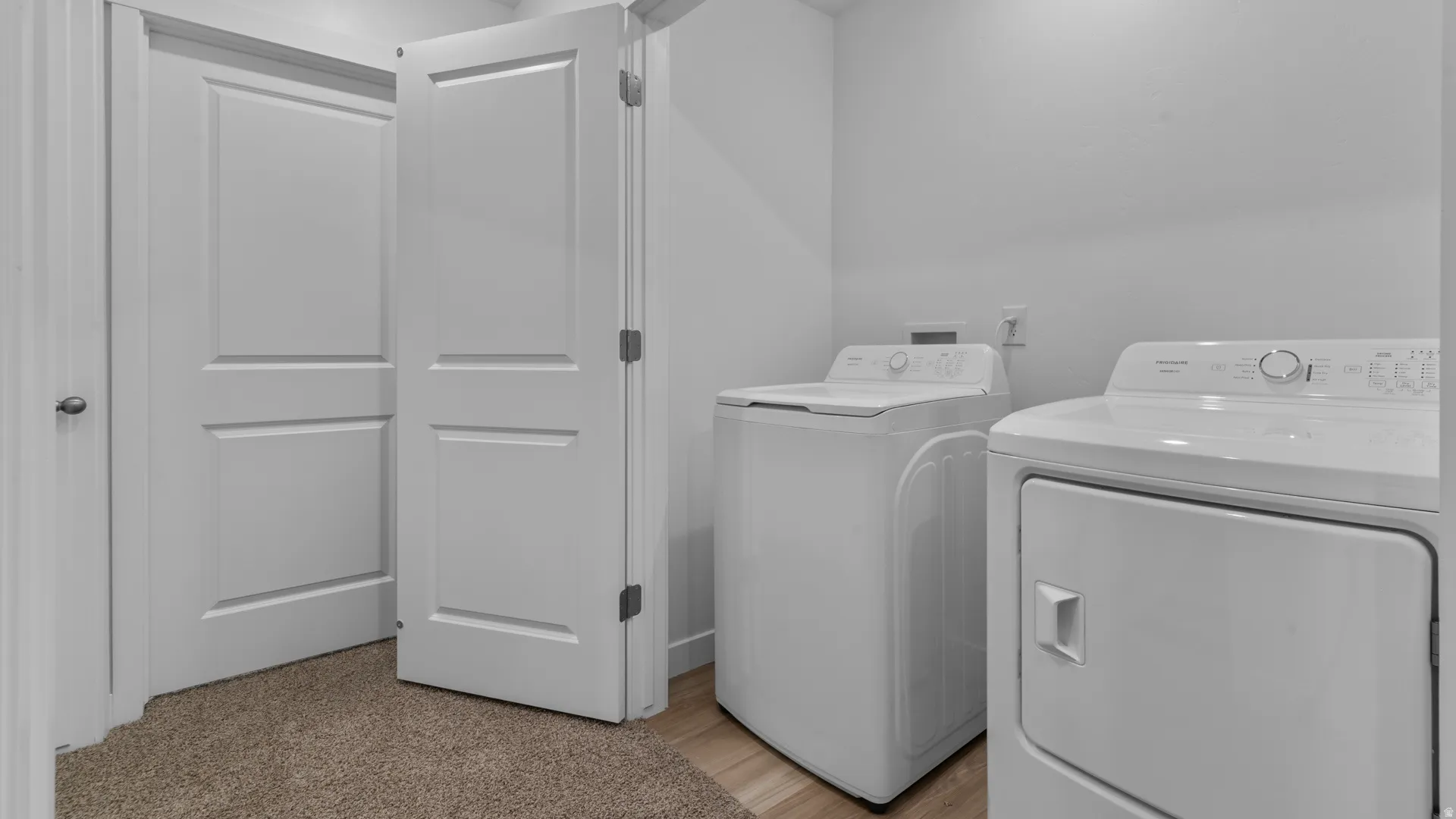 White interior doors, neutral wall paint, and recessed lighting