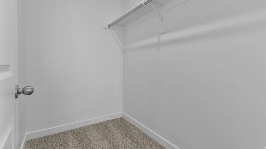 Wall-to-wall carpeting and neutral wall tones