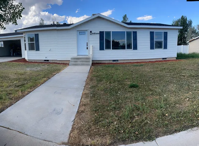 White siding exterior with dark shutters