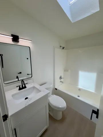 Modern vanity with a quartz countertop and integrated sink