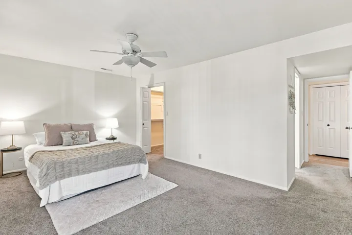 Primary bedroom with en suite bathroom and walk-in closet