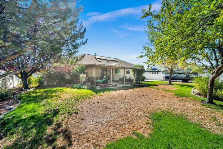 Charming residence set on expansive grounds with mature shade trees framing the property