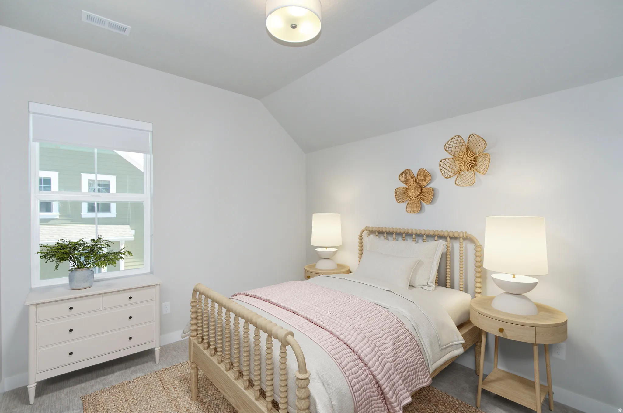 Bright bedroom featuring sloped ceilings, a double-hung window, and a flush-mount ceiling light fixture