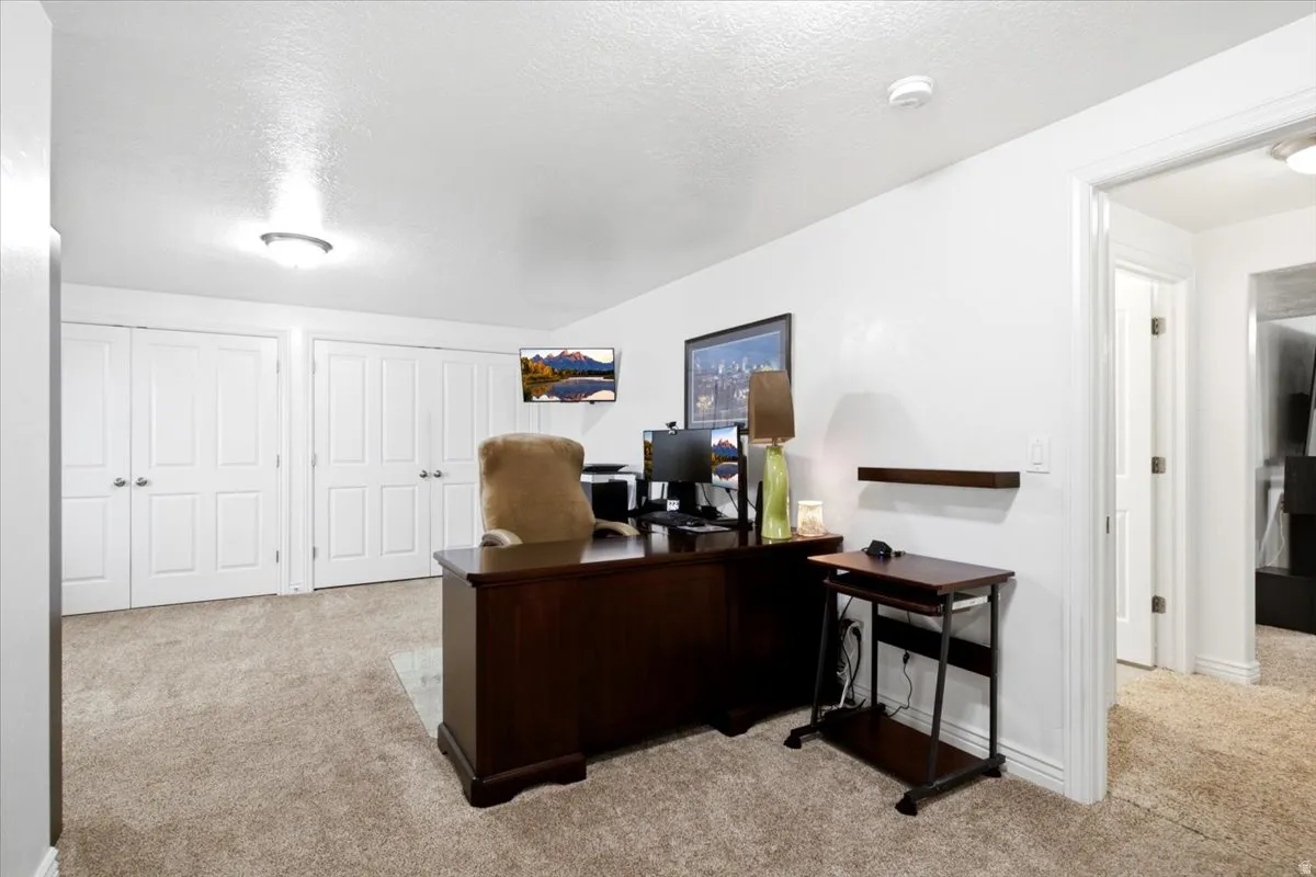 An additional basement gathering area provides flexible space for a home office, hobbies, or recreation.