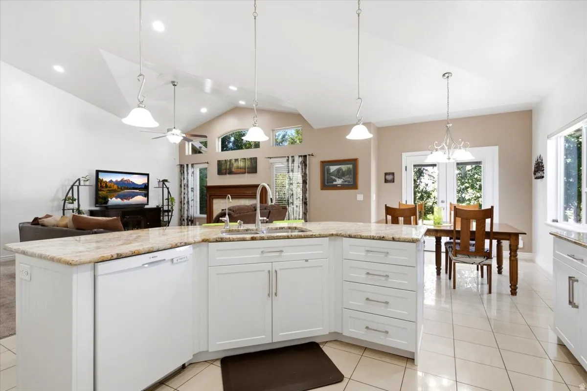 Vaulted ceiling and abundant natural light! Kitchen and dining lead out to fantastic deck with pergola, a nice secondary entertaining space.