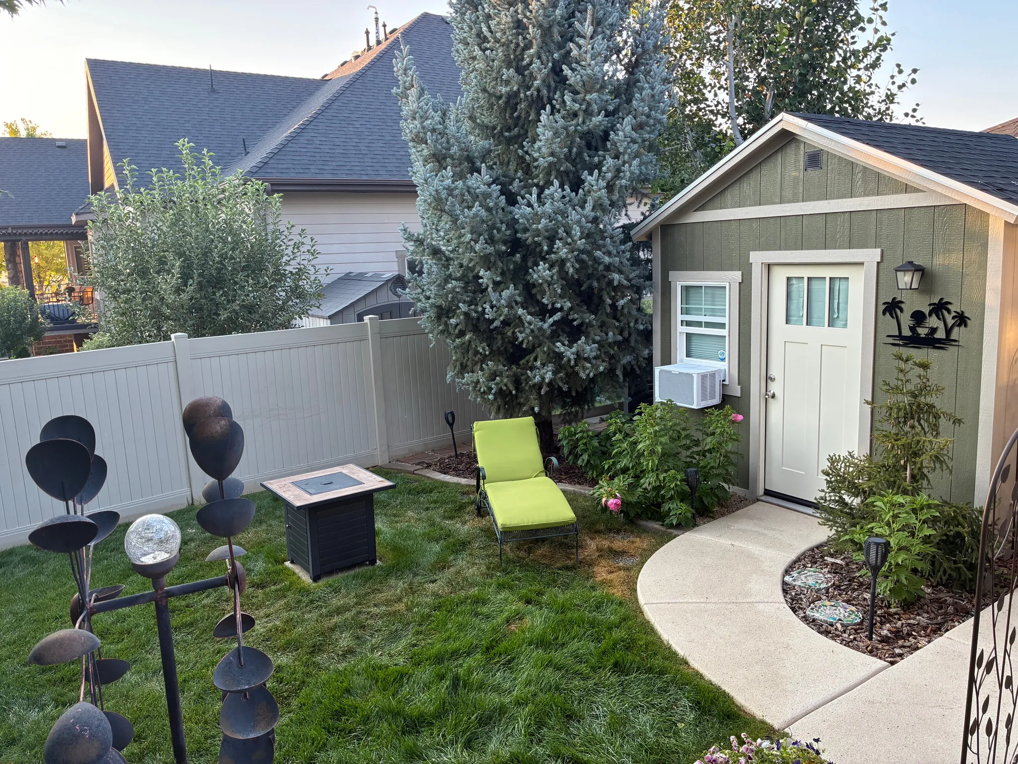 Fully finished custom wood shed includes power, air conditioning, an electric wall heater, a ceiling fan, and a perfect flex space for an office, hobby room, exercise room or entertainment room