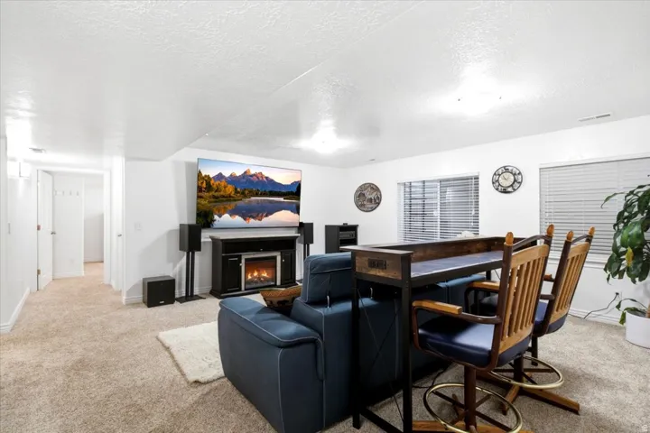 The fully finished basement offers generous gathering spaces with plenty of room for relaxing, entertaining, and recreation.