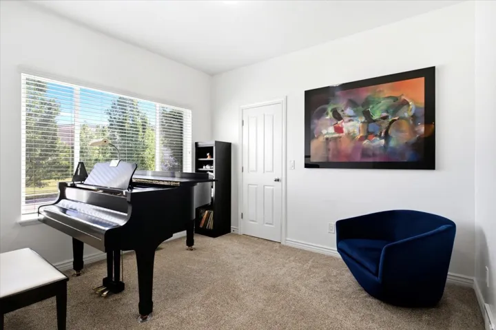 The front office, music, or flex room is conveniently located just off the entry and filled with abundant natural light.
