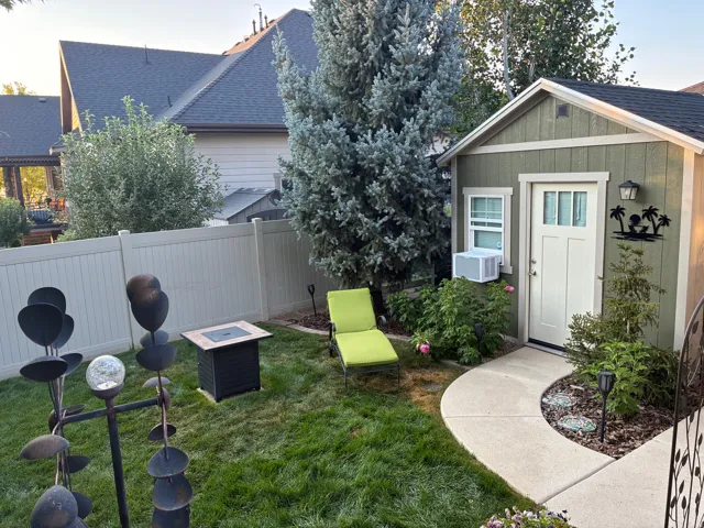 Fully finished custom wood shed includes power, air conditioning, an electric wall heater, a ceiling fan, and a perfect flex space for an office, hobby room, exercise room or entertainment room