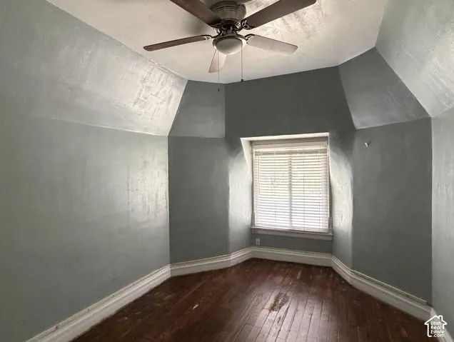 Ceiling fan with light fixture, hardwood flooring, window with blinds