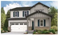 Two-story residence with a covered front porch, attached three-car garage, and horizontal siding