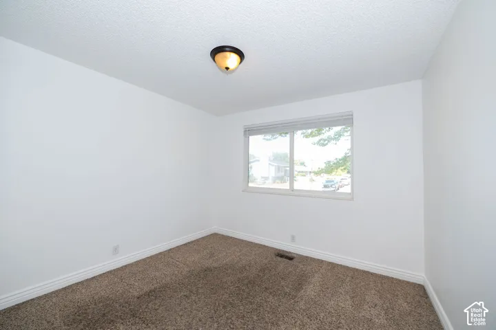 Neutral wall finishes and carpeted flooring