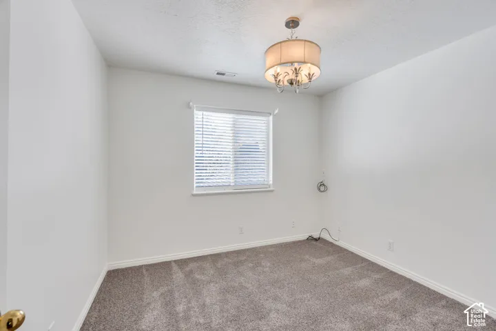 Neutral carpet flooring complements white walls